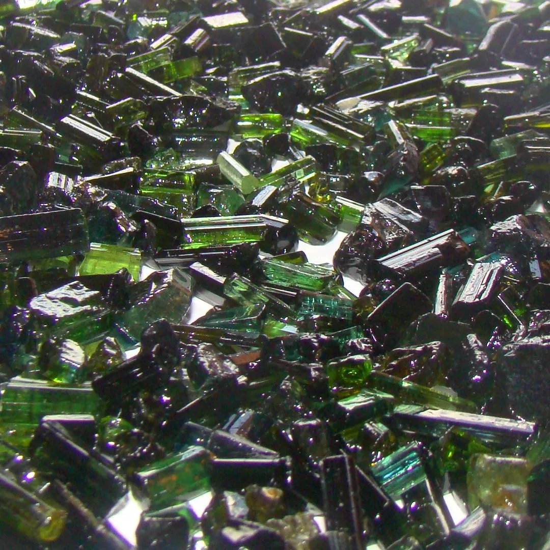 Brazilian green tourmaline rough used to discuss private gemstone sourcing